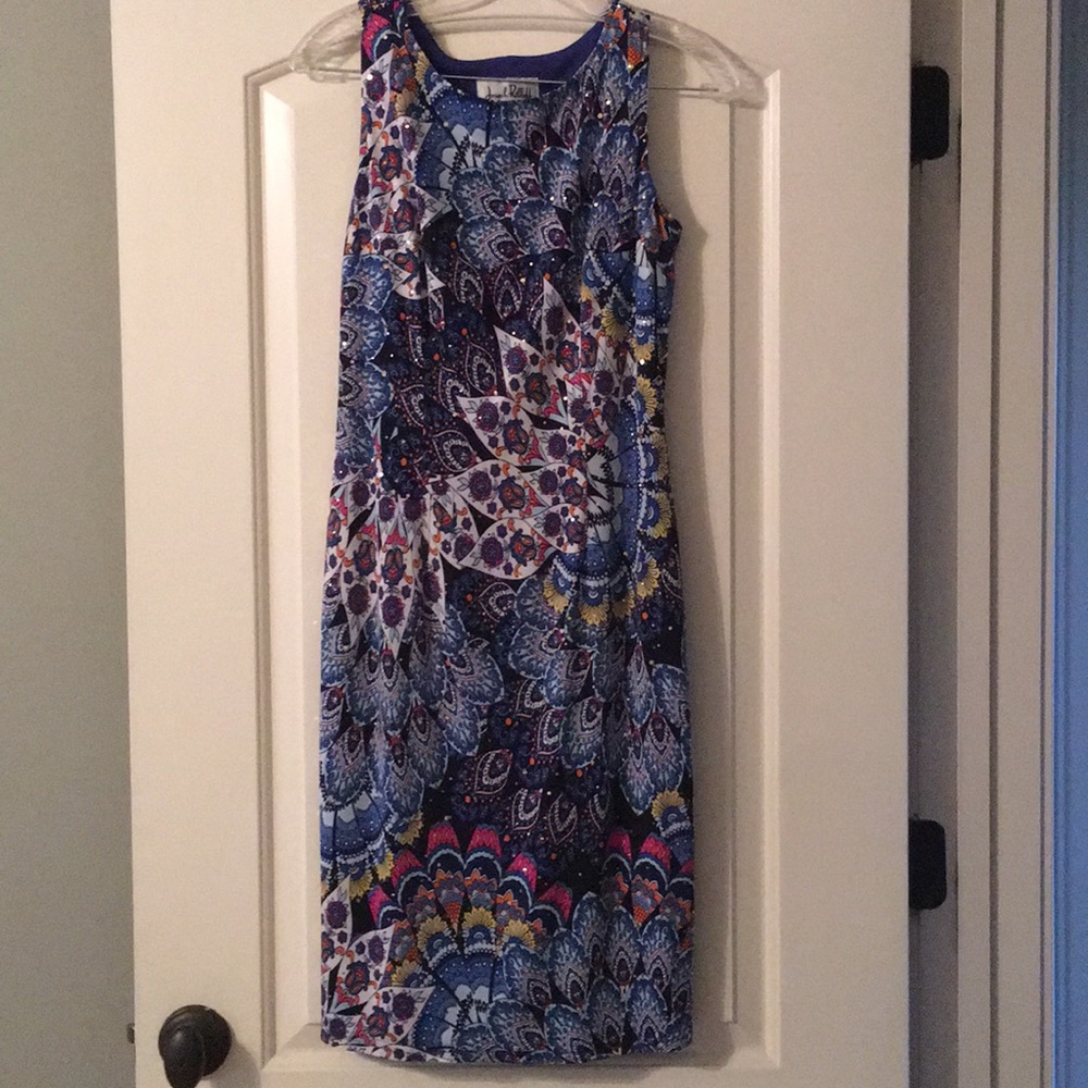 Beautiful multicolored dress with gold garnishes
